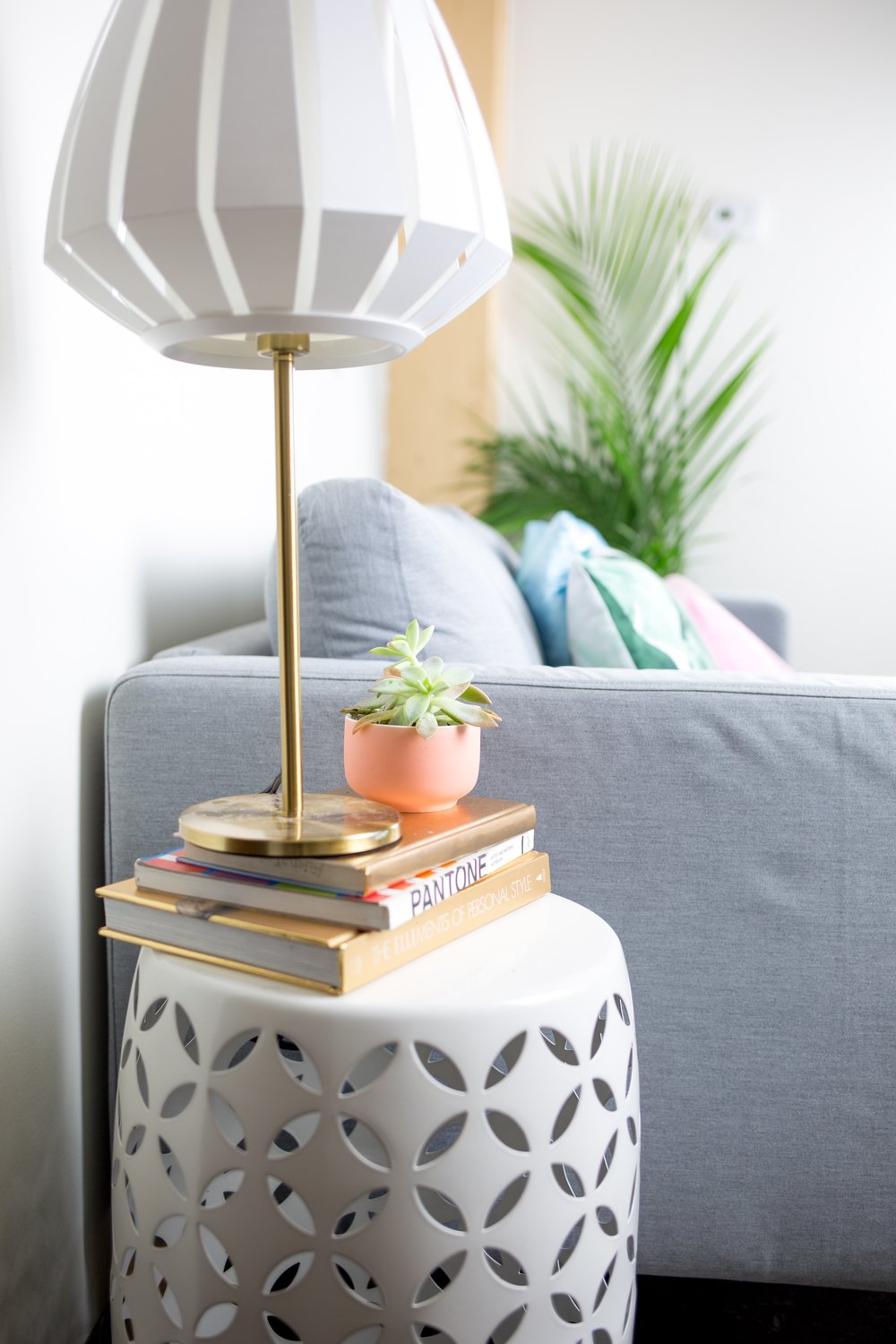  Utilized a white garden stool (another gem from Studio DIY's studio sale) as a side table and gave it some extra height with some of my favorite coffee table reads. 