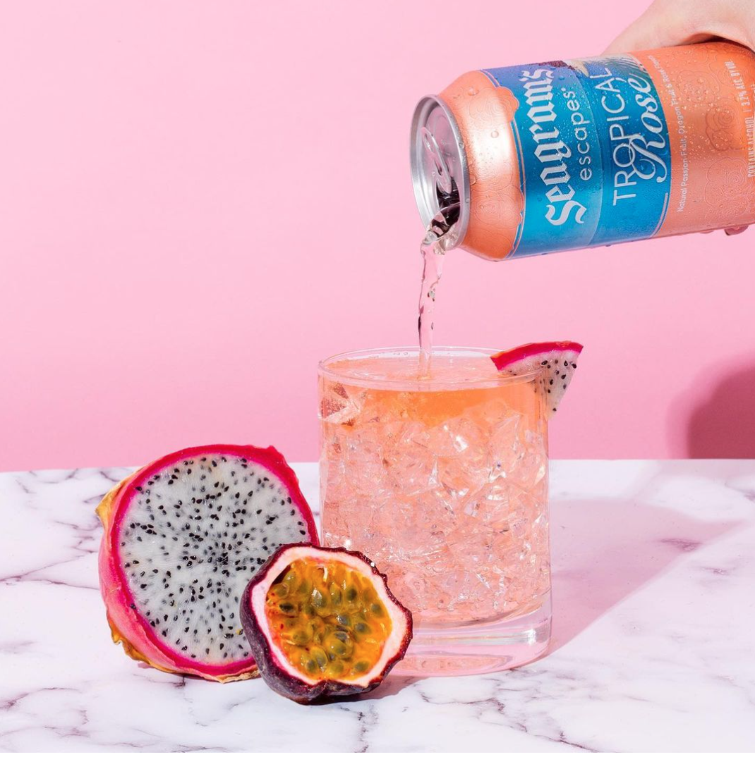 dragonfruit photo with seagrams escape drink on pink and marble backdrop