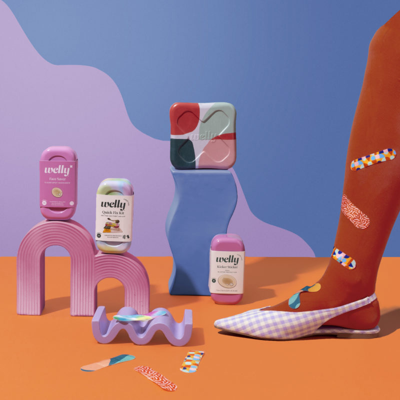 WELLY BANDAGES WITH COLORFUL ABSTRACT BACKGROUND AND A LEG WITH BANDAGES ON IT