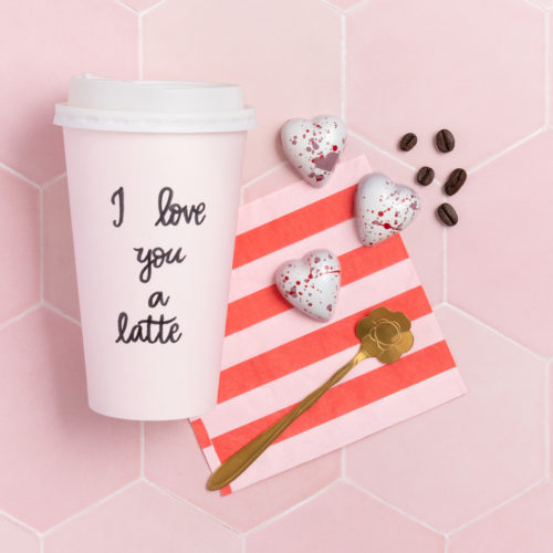 norman love heart-shaped chocolate pictured next to a coffee cup and striped napkin