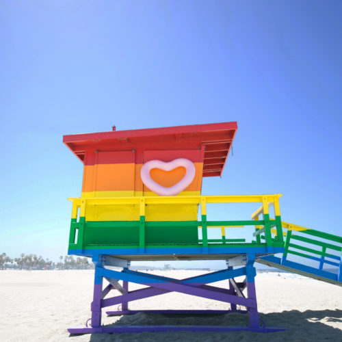 lifeguard beach shed painted in rainbow colors